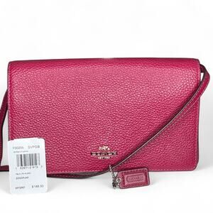 Coach Foldover Crossbody Clutch in the color Dark Fuchsia leather w/ charm NWT